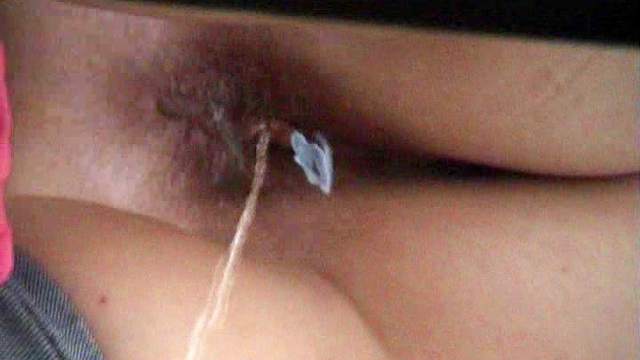 Hot babe with tampon is pissing