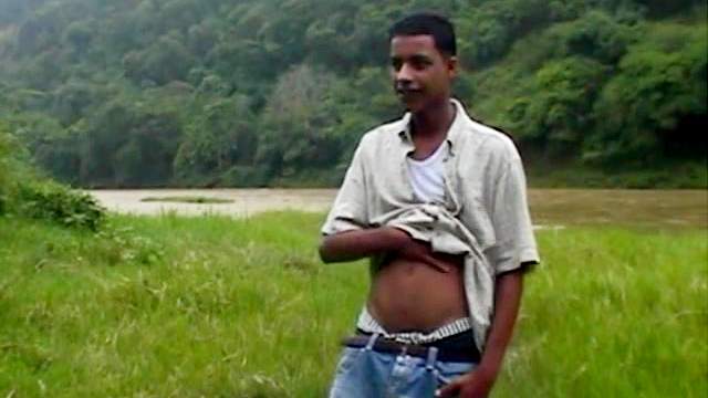 Black gay is masturbating outdoors in a solo video
