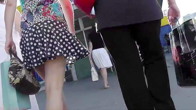 Small peek up a chick's skirt