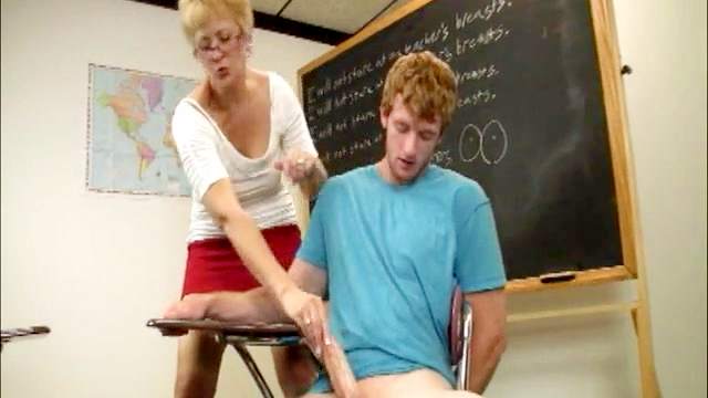 Hot blonde teacher is stroking a big dick