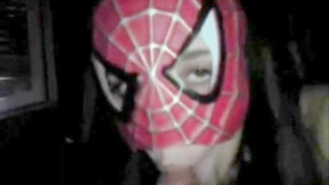 Spicy babe gives a blowjob in the spiderman mask
