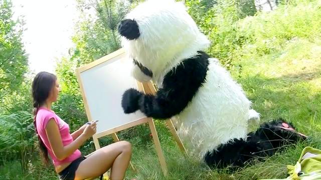 Dark-haired babe fuck in the forest with panda