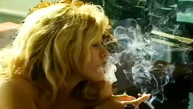 Curly blonde is smoking so sexy