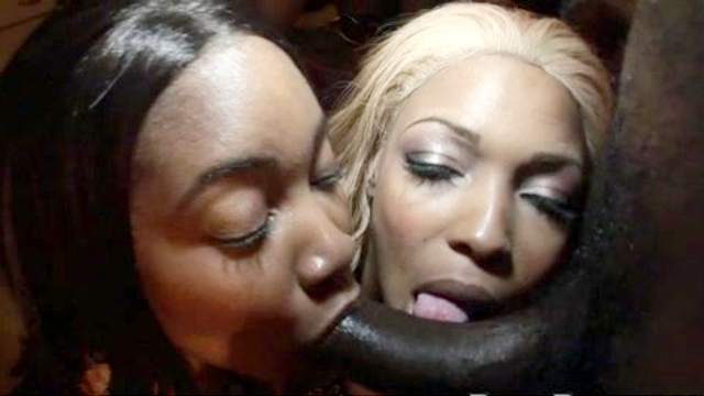 Three black babes are sucking dark dick