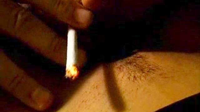 Mature blonde gets fingered while smoking
