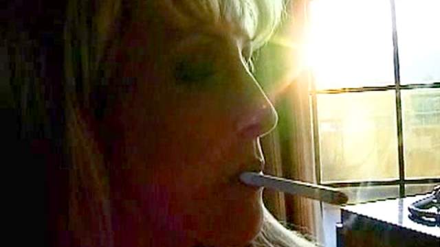 Milf is smoking and giving a blowjob