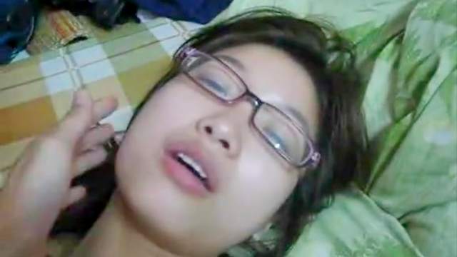 Sensual Asian model in glasses gives a blowjob