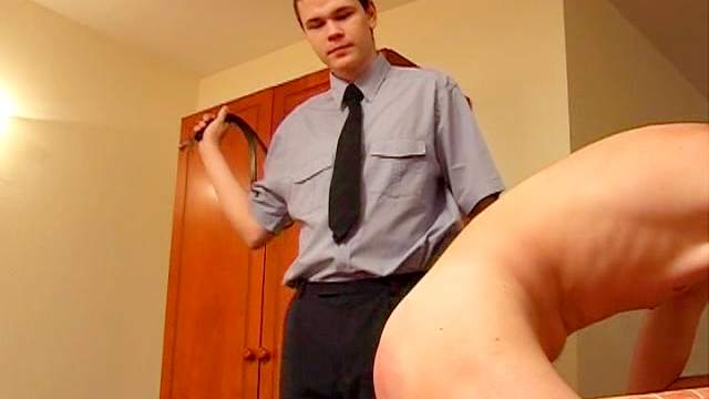 Brunette master spanks his gay slave