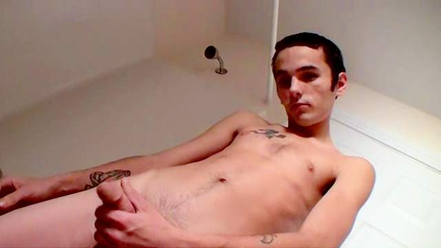 Skinny young gay is wanking his hard dick