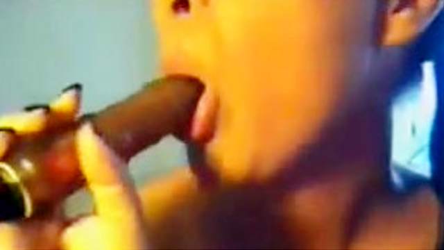 Pigtailed beauty brunette is sucking her lovely dildo