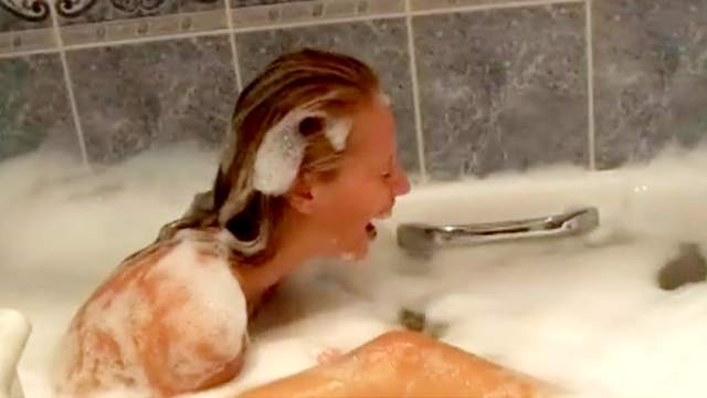 Debbie is having lesbian sex in the bath