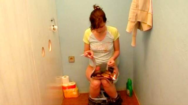 Short-haired brunette suck a dick in the toilet