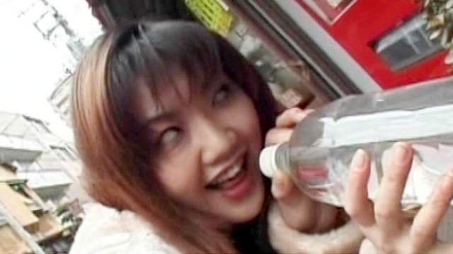 Asian babe is drinking sperm from a bottle