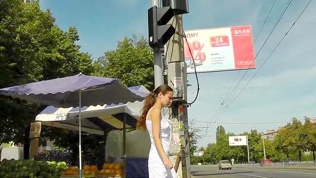 Young girl in sexy dress filmed outdoor upskirt
