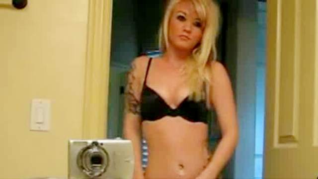 Amateur blonde with tattoos is posing naked
