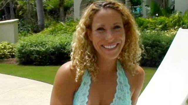 Sexy curly-haired mom is sucking a big pole