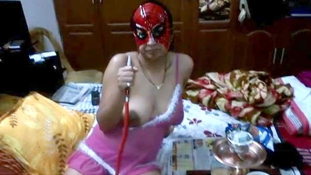 Sexy amateur in mask is smoking and masturbating