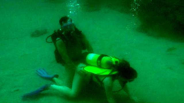 Busty girl having underwater sex with her man