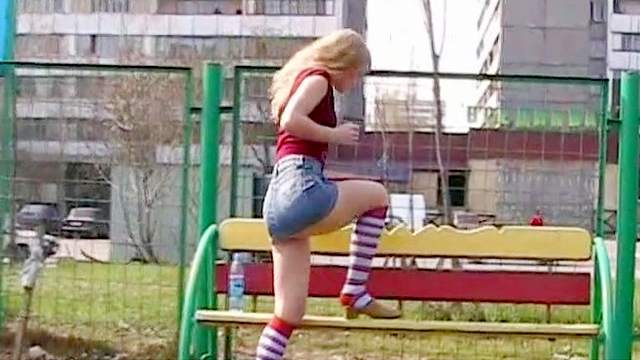 Blonde is fucking her tight puss outdoors