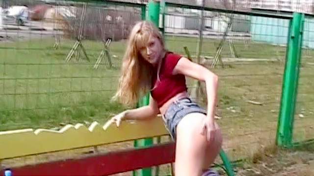 Blonde is fucking her tight puss outdoors
