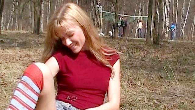 Hardcore blonde is masturbating her pussy outdoors