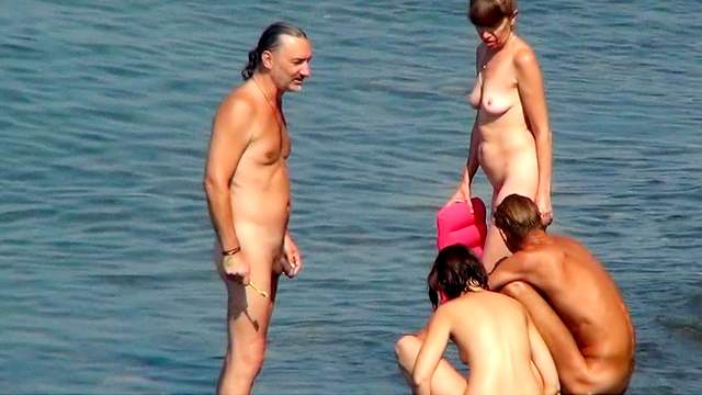 Stunning busty brunette is posing in doggy style