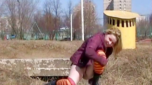 Public pissing with a nice-looking blonde