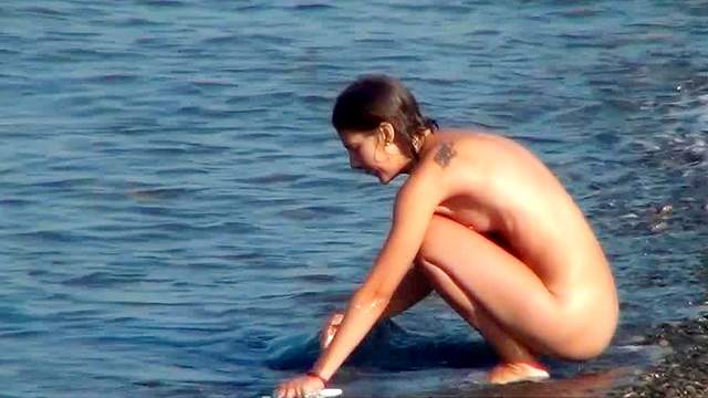 Sexy babes nudists are tanning on the beach