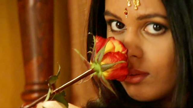 Erotic Indian chick is playing with flowers