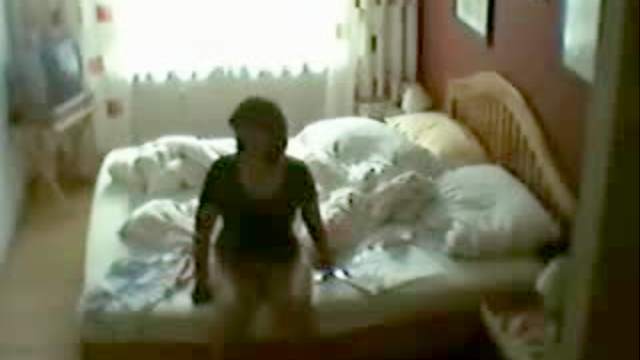 Masturbating babe at home in bed