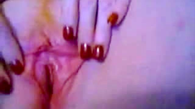 Red painted fingernails during masturbation