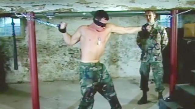 Rough gay gangbang with bondage and handcuffs during the military drill