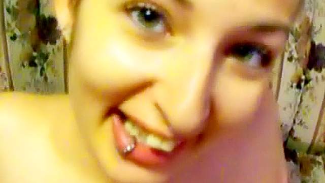 Tattooed and pierced slut sucks cock