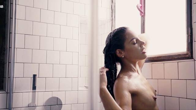 Fine looking woman bends ass and masturbates in the shower