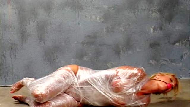 Plastic wrap bondage with cute blonde