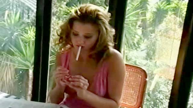 Watch Carli Banks smoke a cigarette