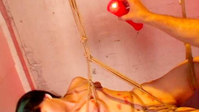 Rope bondage suspension and hot wax play