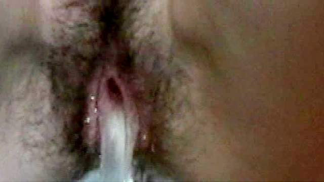Girl with tampon in pisses in close up