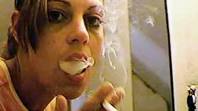 In her bathroom smoking and doing makeup