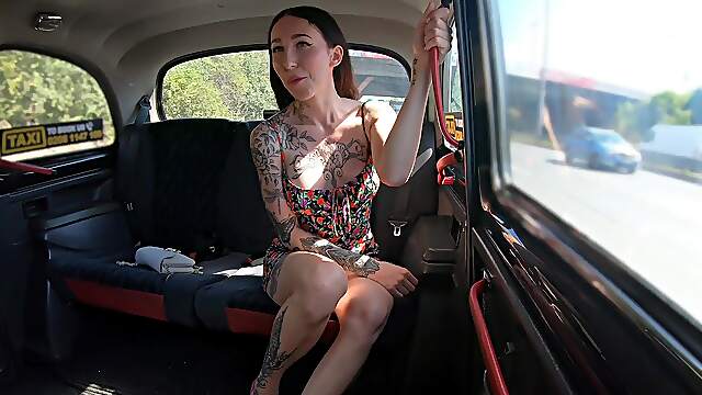 Inked beauty takes it hard in her wet holes for a nice taxi ride