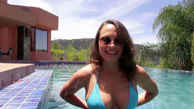 Curious brunette Lily Love with glasses is giving amazing blowjob in the poolside