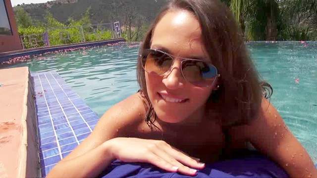 Curious brunette Lily Love with glasses is giving amazing blowjob in the poolside