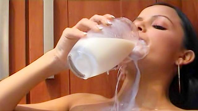 Teen pours milk down her tight body
