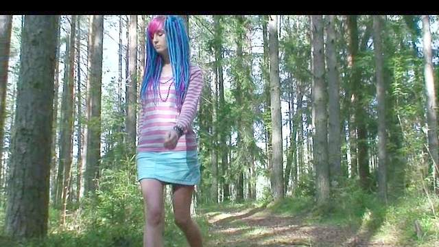 Punk teen takes a piss in the woods