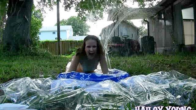 Hailey Young sucks rides the slip and slide