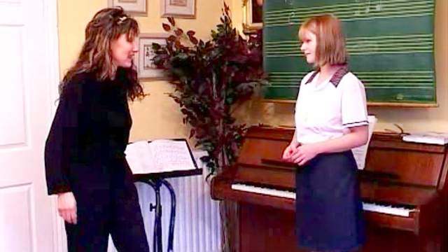 Piano teacher spanks her student hard