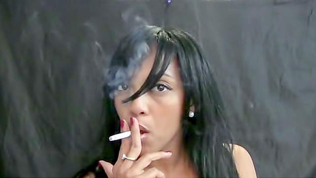 Sexy Latina smokes cigarette sensually