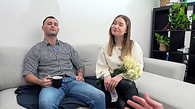 Two hot babes, amalia and peaches, share a guy’s cock on the sofa.