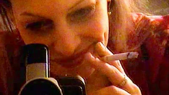 Milf lights up cigarette and smokes