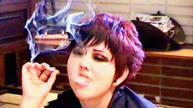 Goth girls smoke and talk at home